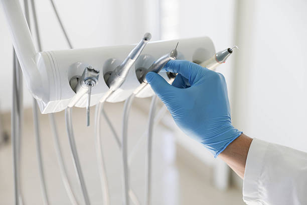 Professional Tooth Extraction technician working in St. Louis, MO